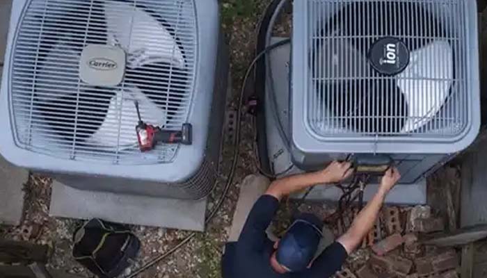 Home air conditioner unit showing signs of malfunction on a warm day.