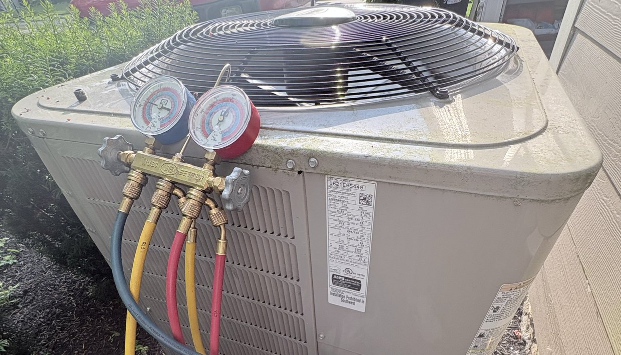Refrigerant gauges on an air conditioner that was running but not cooling during a New Albany, Ohio service call