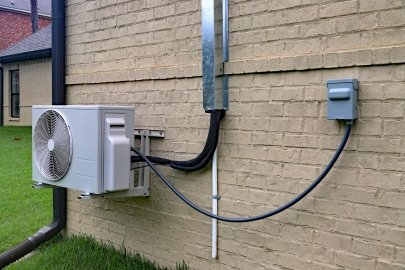 Ductless mini-split HVAC system with outdoor unit and indoor wall-mounted air handler